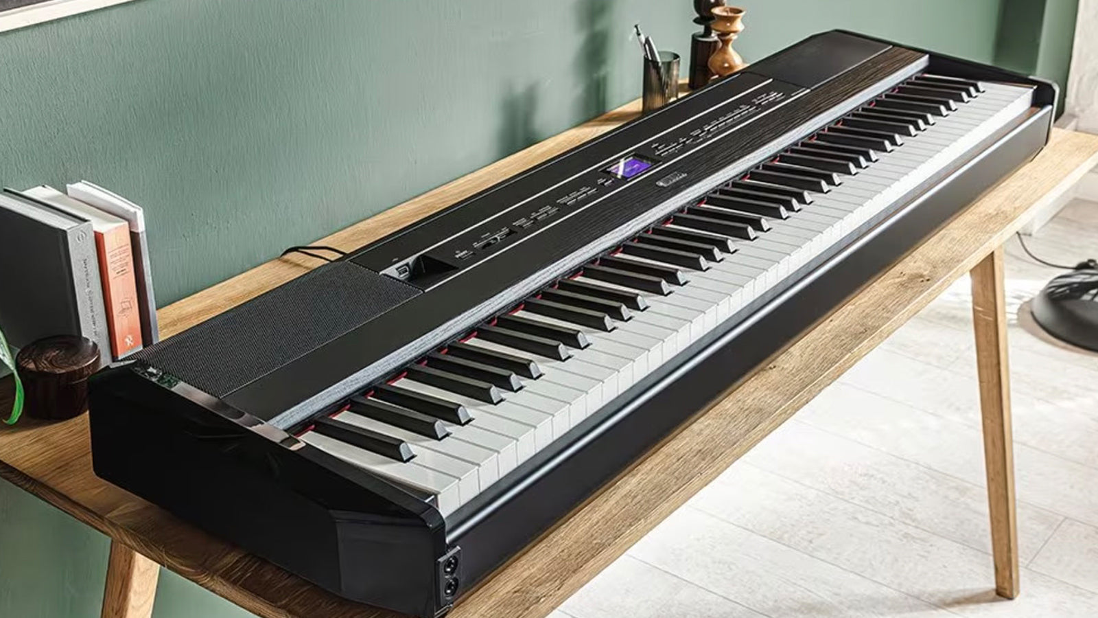 A Yamaha P-525 digital piano on a desk