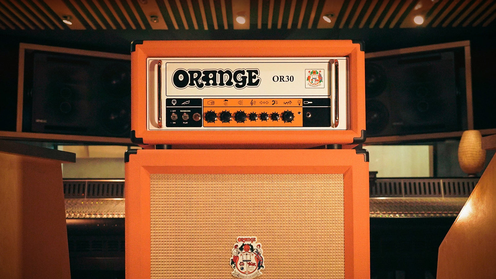An Orange amplifier head an cabinet in a recording studio