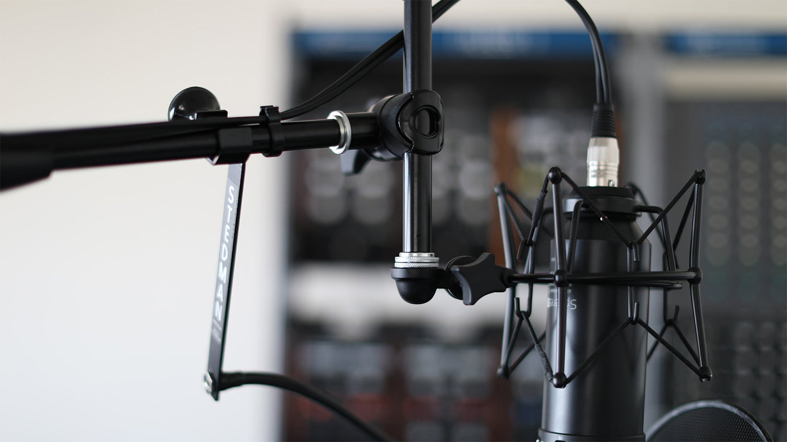An Ultimate Support mic stand in a studio setting