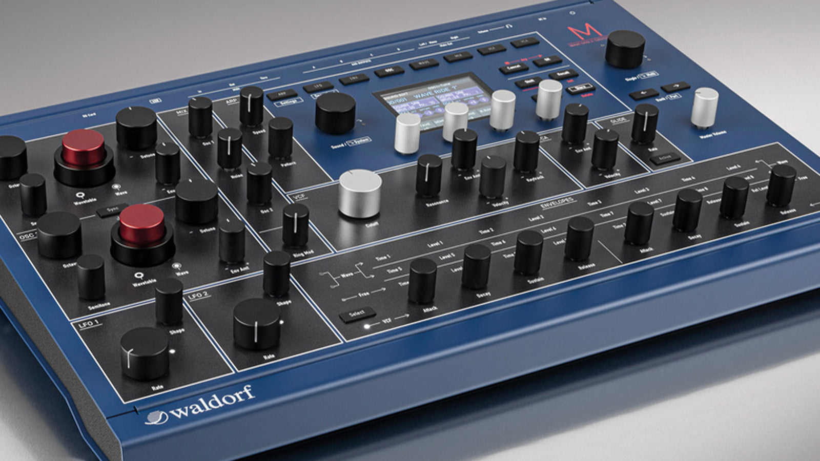 A Waldorf M Desktop Wavetable Synthesizer on a gray background