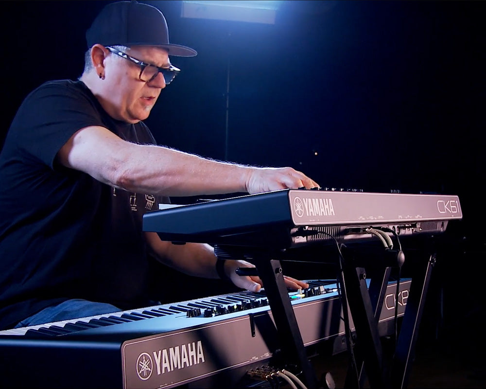 Man playing Yamaha CK61 and CK88 stage keyboards