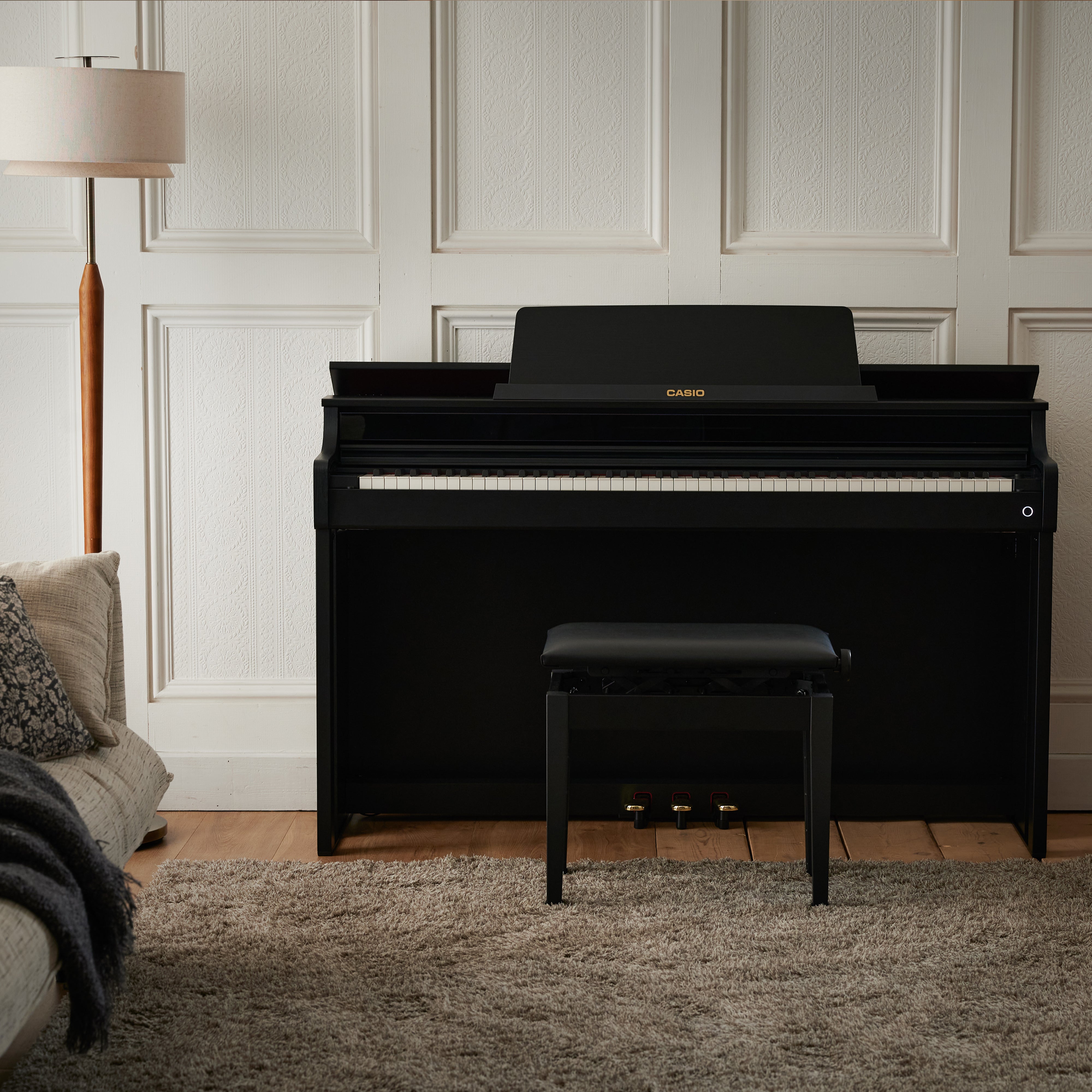 Casio Celviano AP-550 Digital Piano - Black - front view in a stylish living room
