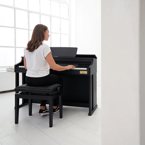 A young lady playing a Casio Celviano AP-710 Digital Piano