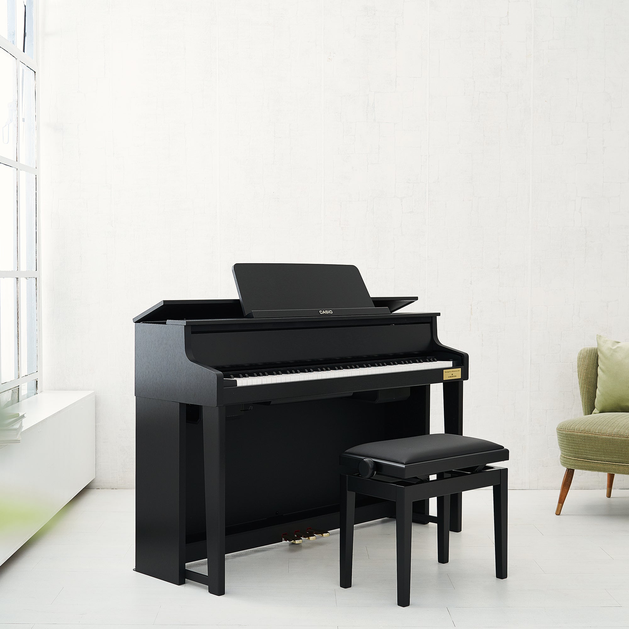 Casio Celviano Grand Hybrid GP-310 Digital Piano - Satin Black in a stylish living room