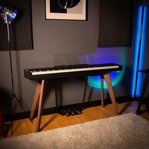 Casio PX-S7000 Digital Piano - Black - right angle view in a home studio