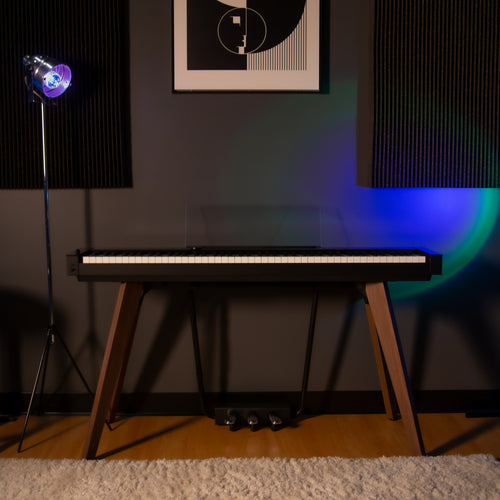 Casio PX-S7000 Digital Piano - Black - front view in a home studio