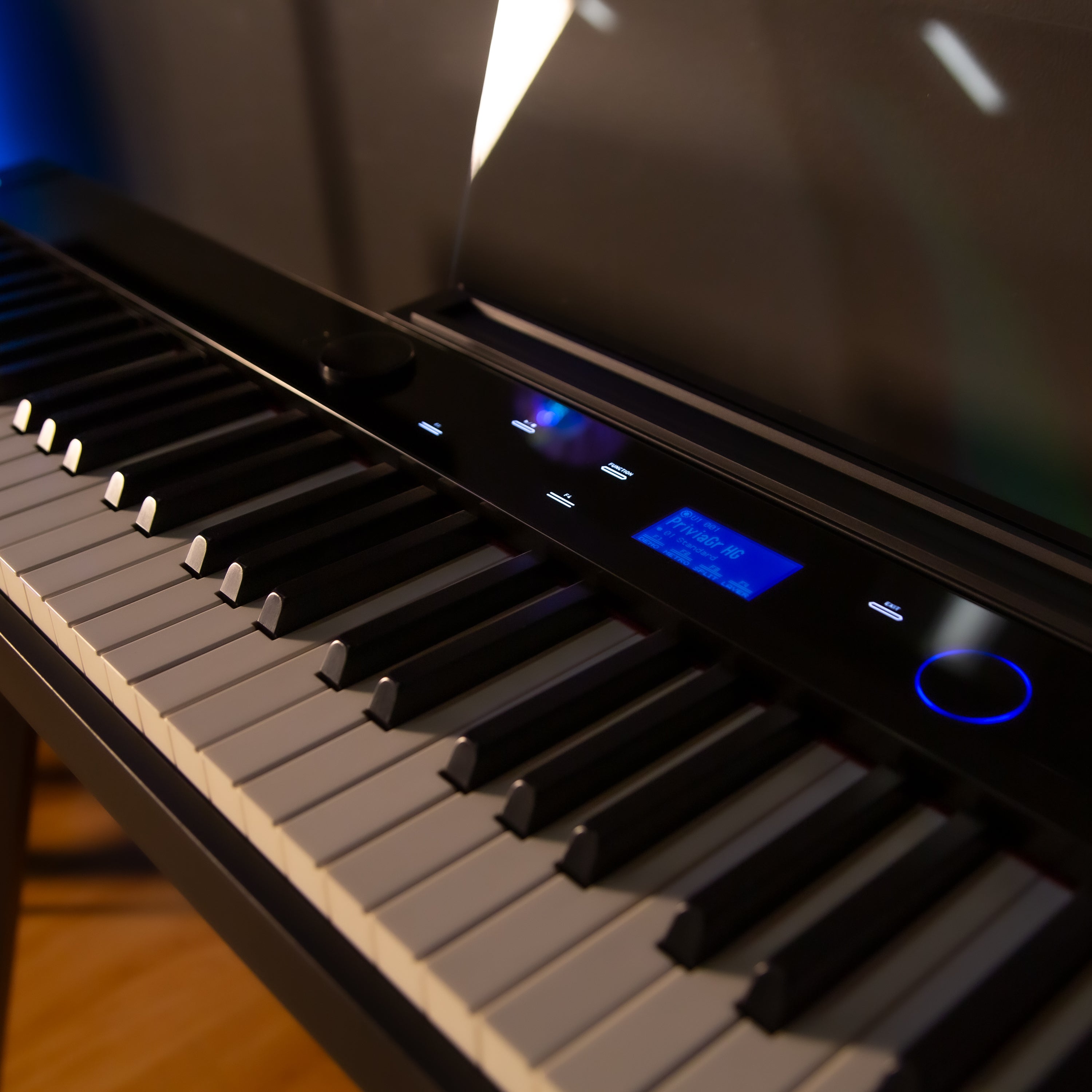Casio PX-S7000 Digital Piano - Black - right angle view, cropped, in a home studio