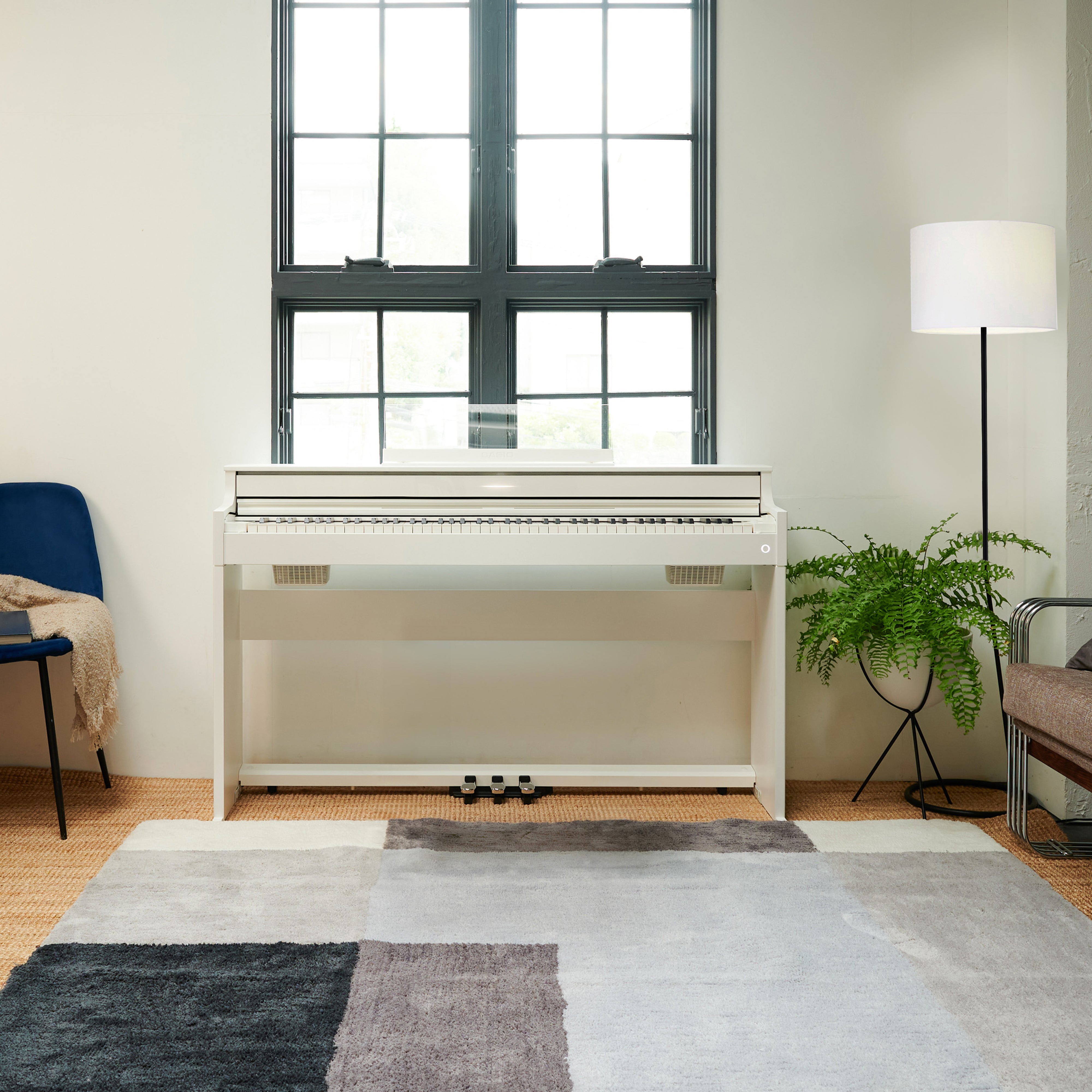 Casio Celviano AP-S450 Digital Piano - White - front view in a quaint living space
