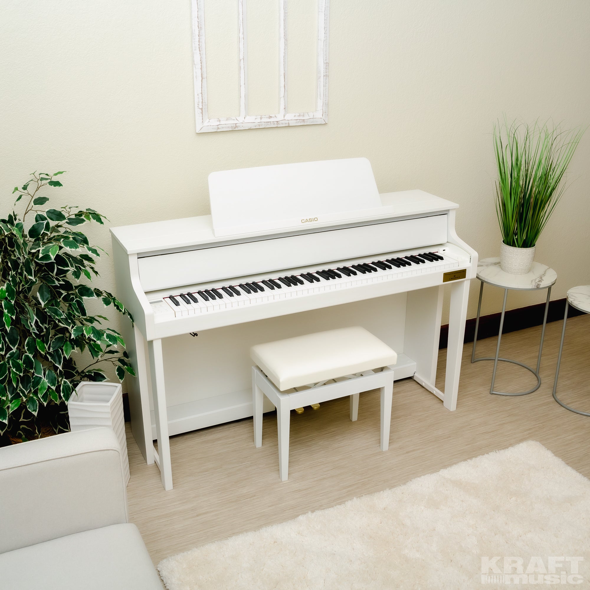 Casio Celviano Grand Hybrid GP-310 Digital Piano - Natural White Wood - Right angle in a stylish living room