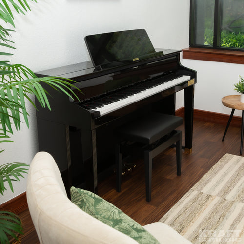 Casio Celviano Grand Hybrid GP-510 Digital Piano - Black Polish - Right angle in a stylish living room