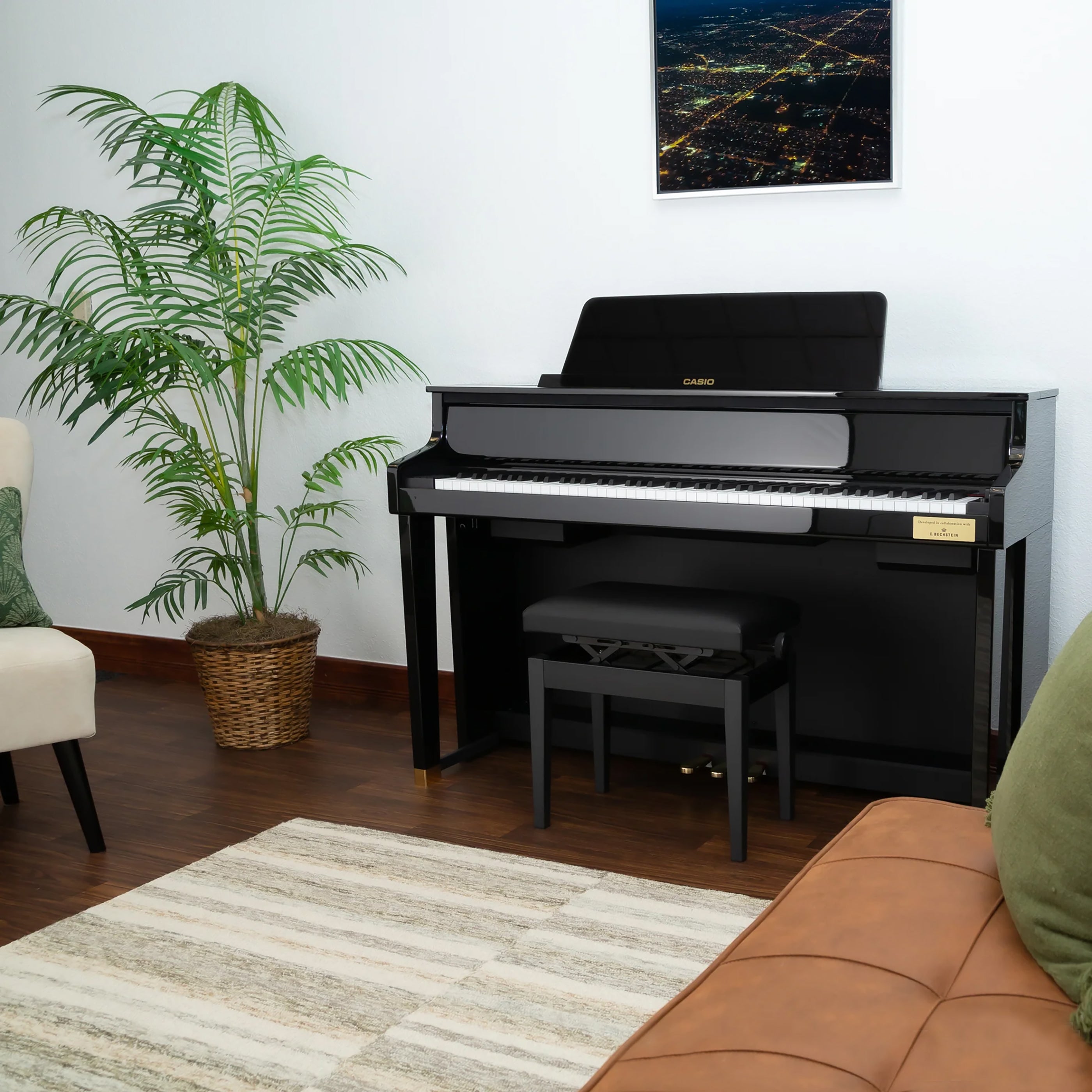 Casio Celviano Grand Hybrid GP-510 Digital Piano - Black Polish - Left angle in a stylish living room