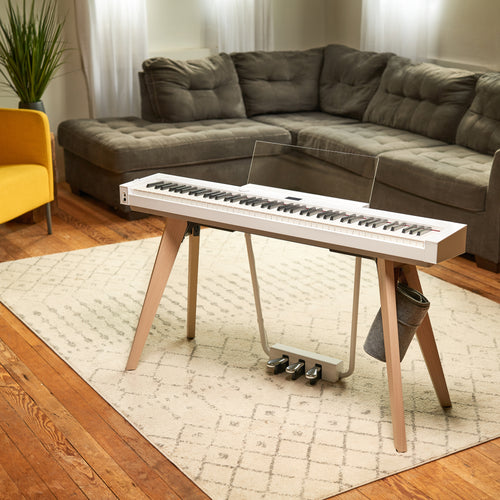 Casio PX-S7000 Digital Piano - White in a stylish room