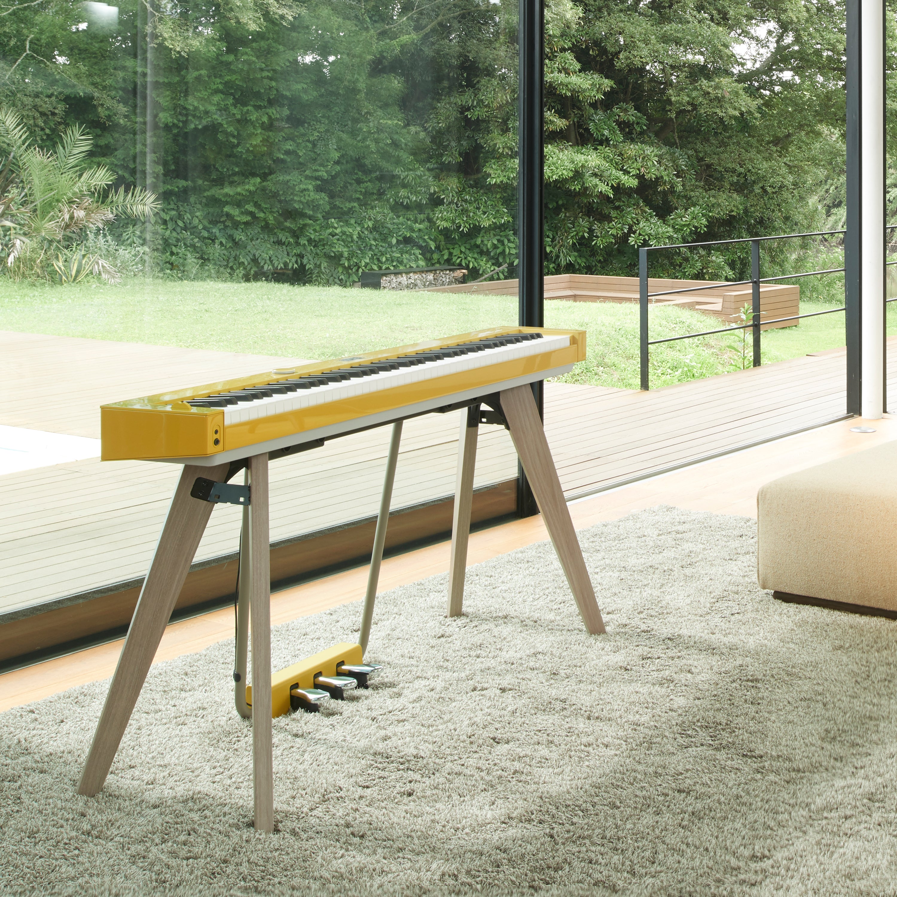 A Harmonious Mustard Casio PX-S7000 digital piano in a stylish living room