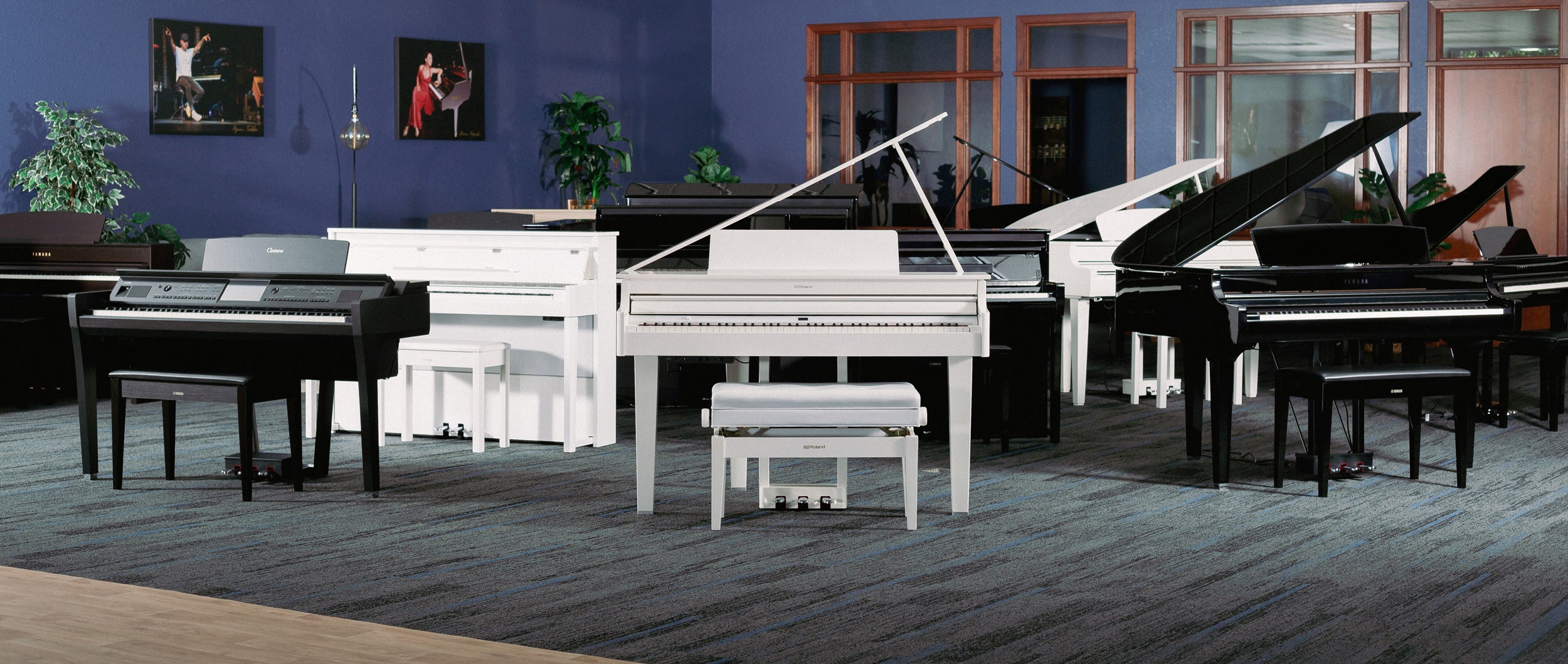 Image of multiple pianos in a showroom
