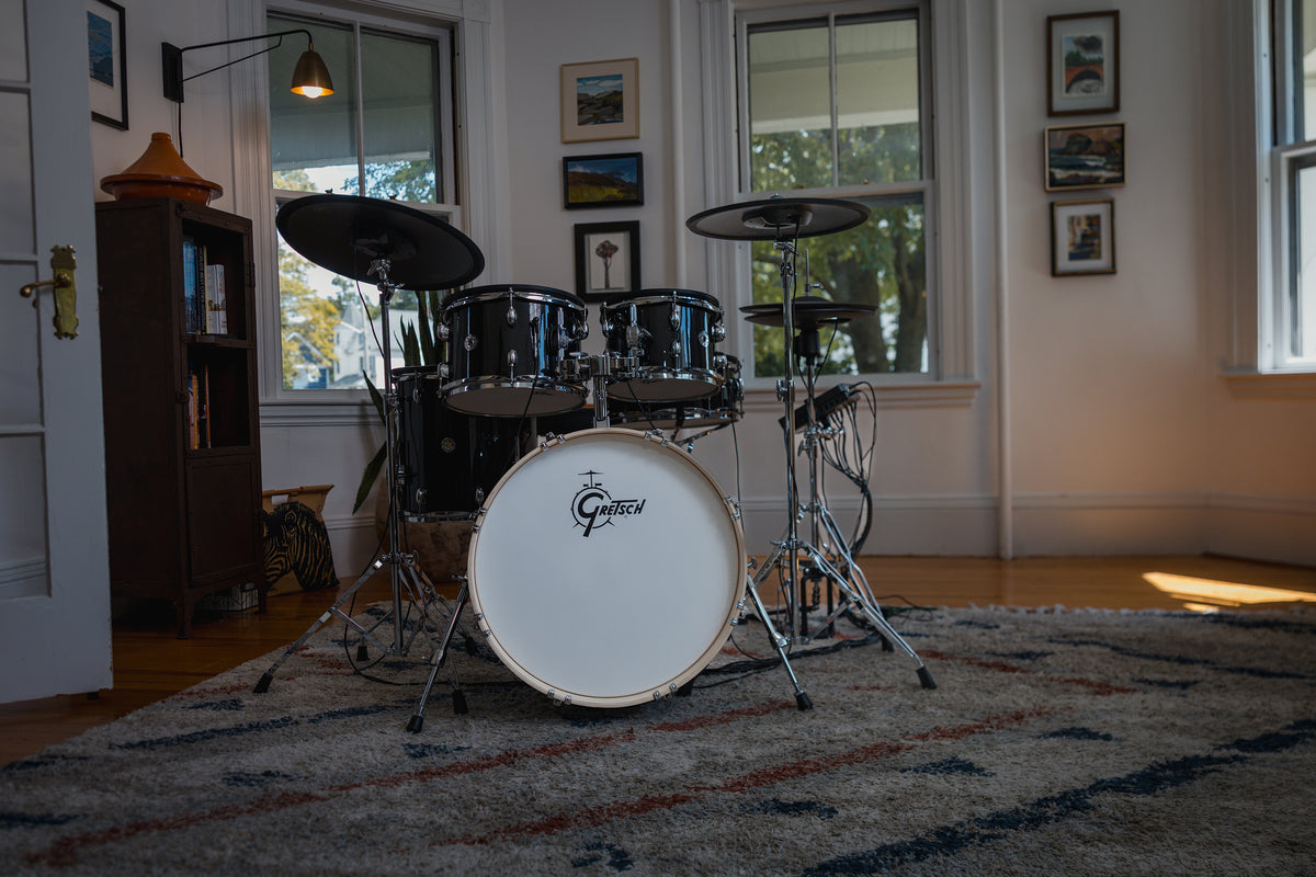 Gretsch Catalina EVO Black Sparkle electronic drum kit set up in a living room, front view