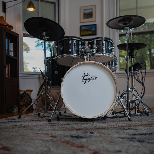 Gretsch Catalina EVO Black Sparkle electronic drum kit in a home setting, low front view