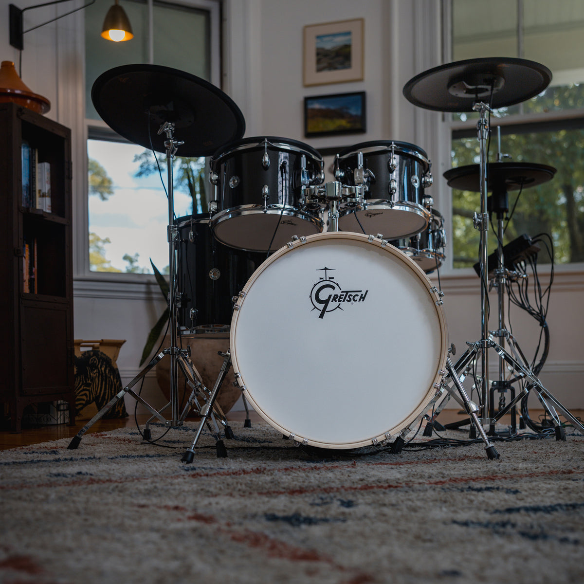 Gretsch Catalina EVO Black Sparkle electronic drum kit in a home setting, low front view