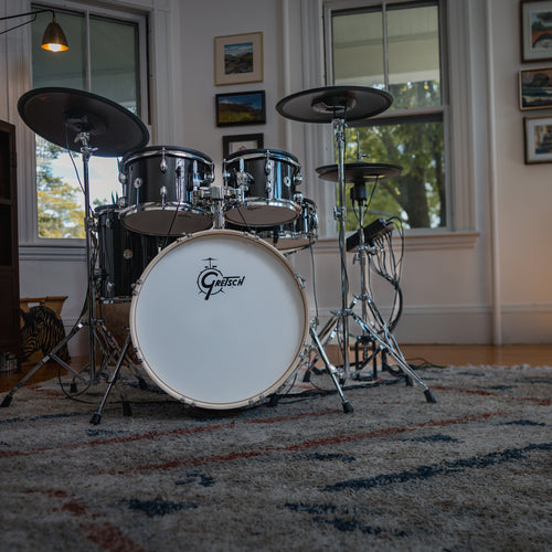Gretsch Catalina EVO Black Sparkle electronic drum kit in a sunlit room, wide front view