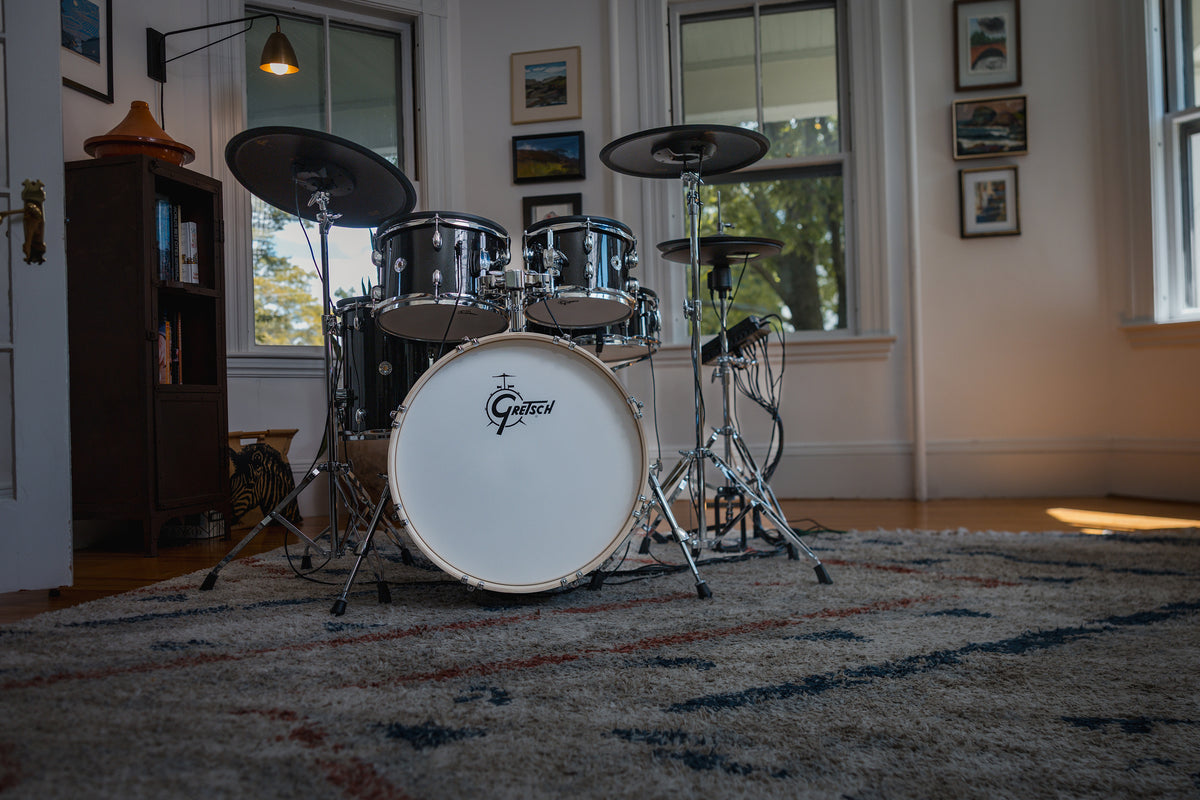 Gretsch Catalina EVO Black Sparkle electronic drum kit in a sunlit room, wide front view