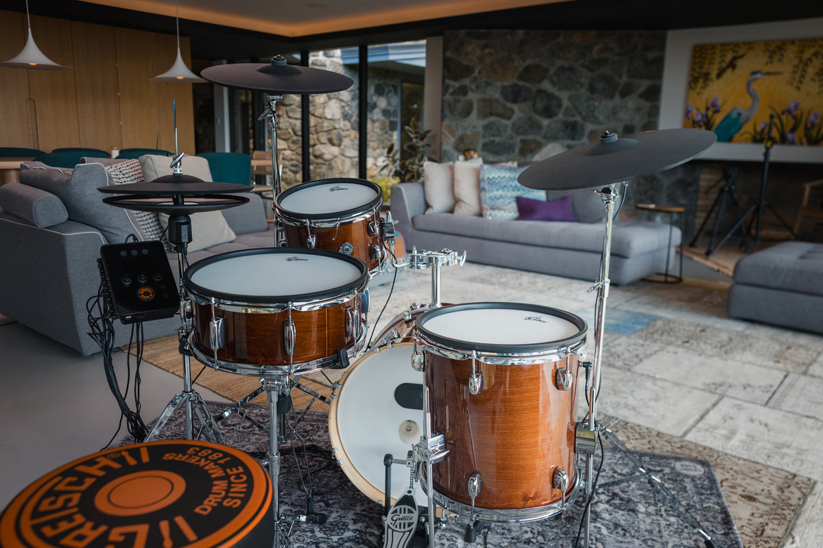 Gretsch Catalina EVO Walnut Glaze electronic drum kit from the drummer's seat in a modern living room