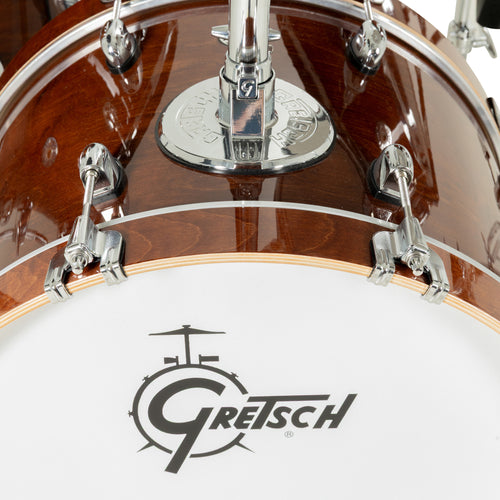 Close-up of Gretsch Catalina EVO Walnut Glaze bass drum with tom mount and Gretsch logo resonant head