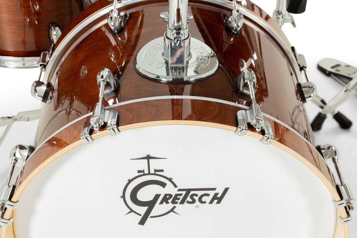 Close-up of Gretsch Catalina EVO Walnut Glaze bass drum with tom mount and Gretsch logo resonant head
