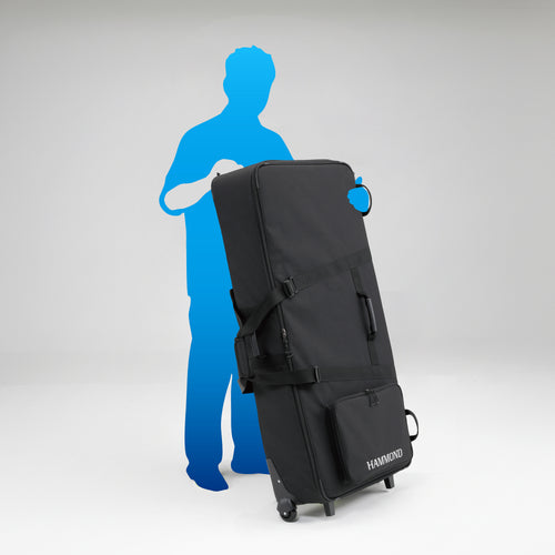 Hammond SCC-XKD Gig Bag shown next to an average height person, the bag when wheeled comes up to the persons chest