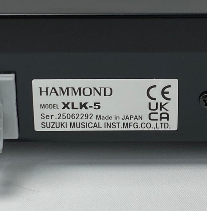 Hammond XLK-5 label on a musical instrument, showing certification logos and model details.