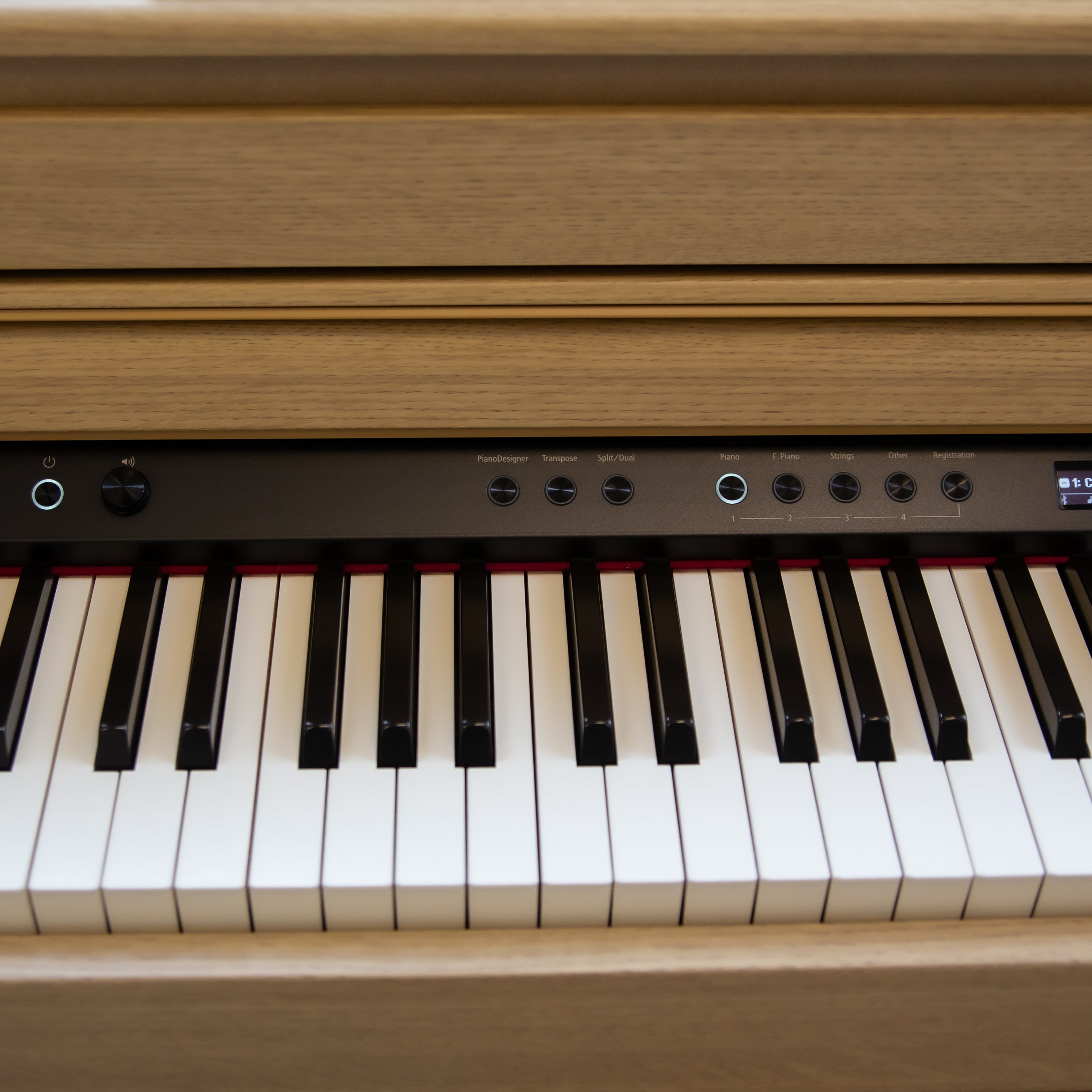 Roland HP704 Digital Piano - Light Oak controls to the left of center screen