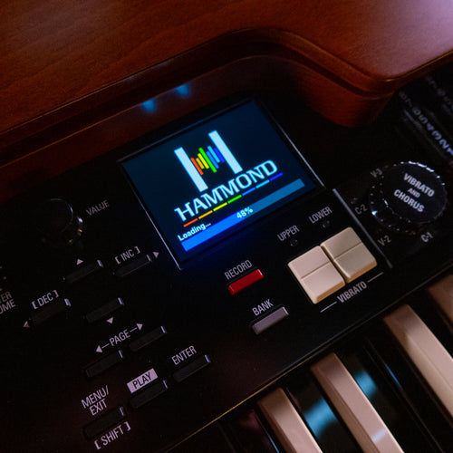 Close-up of the Hammond XK-7D Classic Ultimate Dual-Manual Tonewheel Organ showing the brand logo on its screen