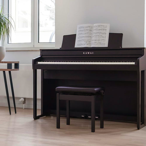 A left angle view of a rosewood Kawai CA401 Concert Artist digital piano in a stylish living room