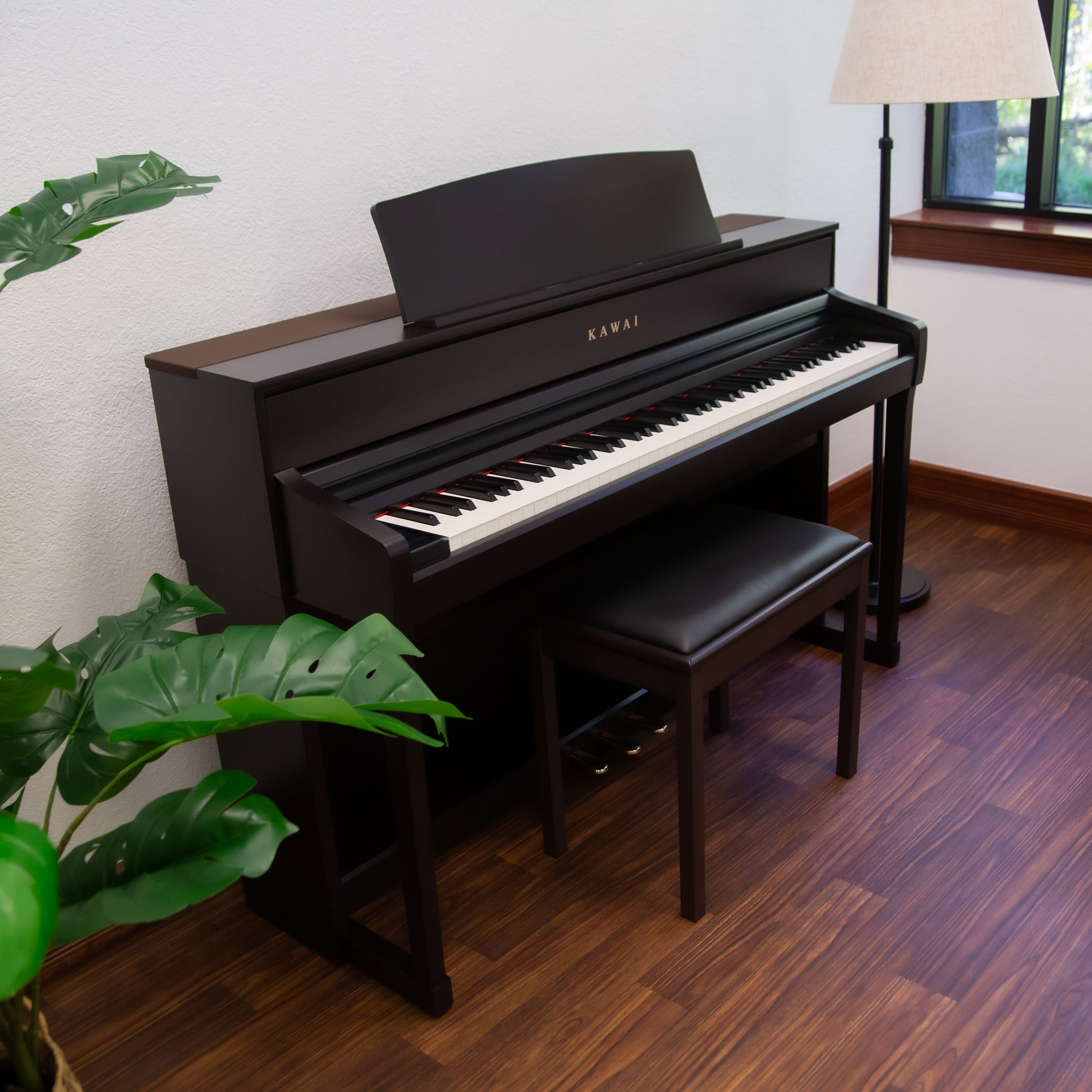 Kawai CA701 Digital Piano - Rosewood - right facing in a stylish living room