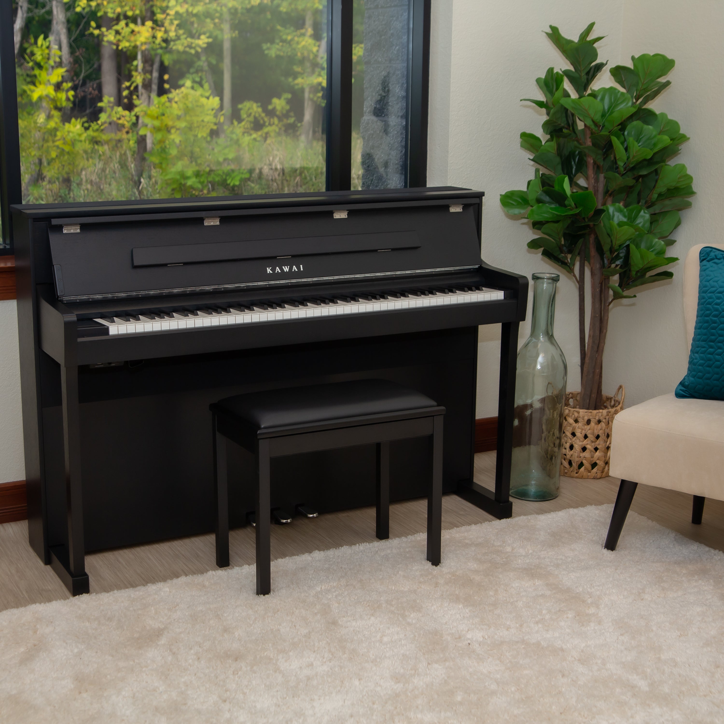 Kawai CA901 Digital Piano - Satin Black - facing right in a stylish living room