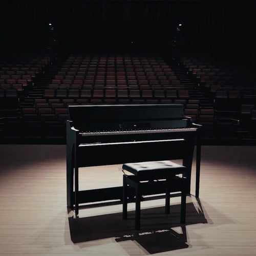 Korg G1B Air Digital Piano - Black - on a dim lit stage