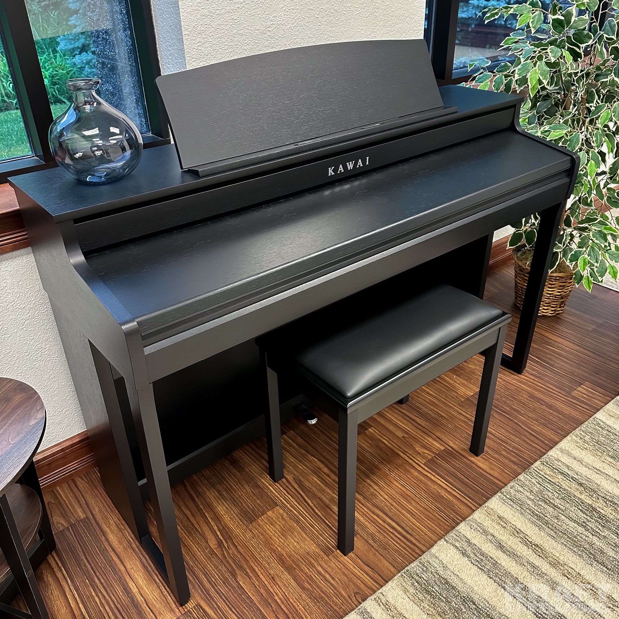 Kawai CA401 Concert Artist Digital Piano - Satin Black - Keyboard cover closed in a stylish living room