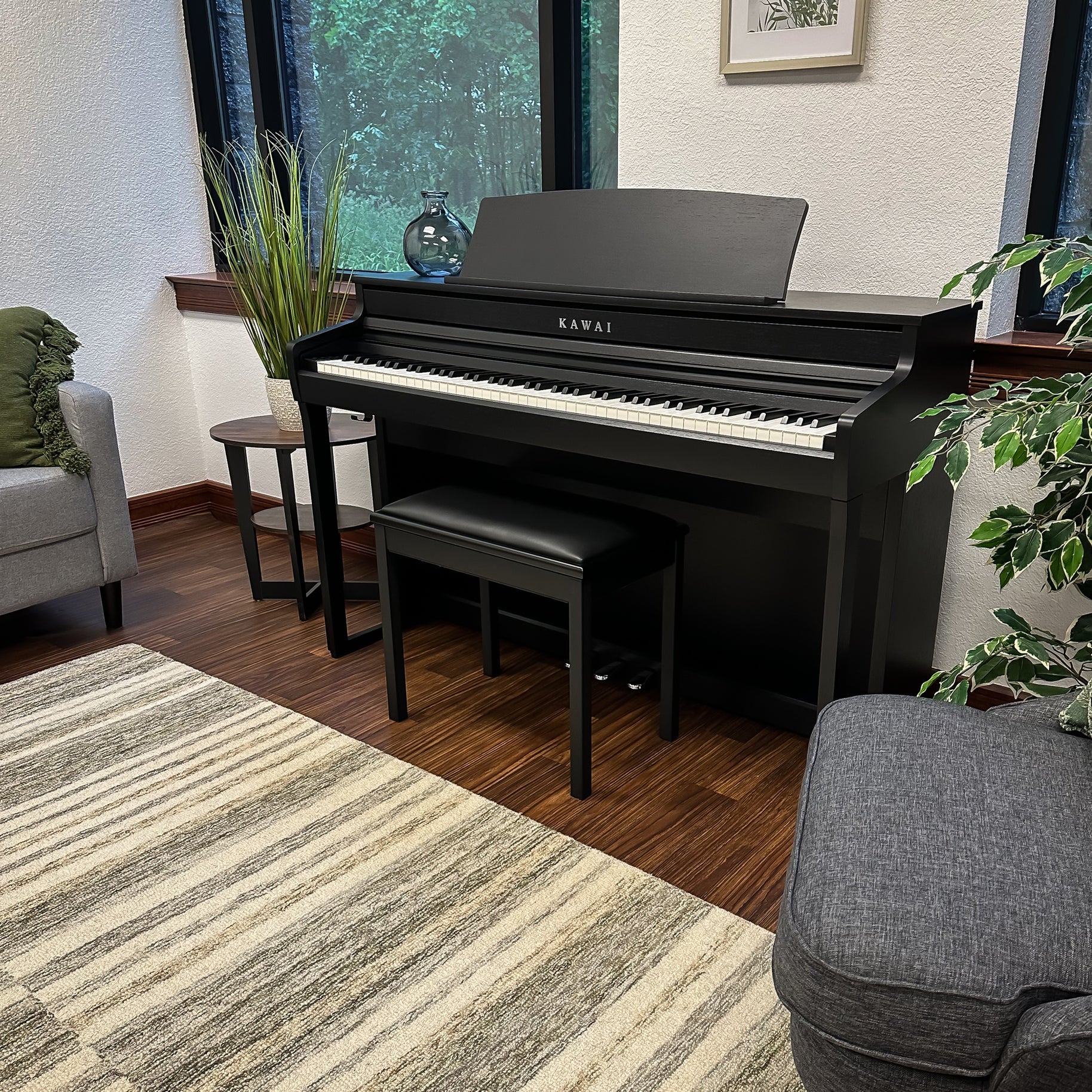 Kawai CA401 Concert Artist Digital Piano - Satin Black - Left angle in a stylish living room