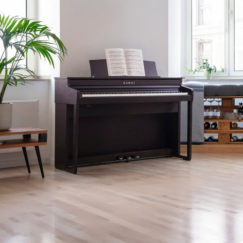 A left angle view of a rosewood Kawai CA401 Concert Artist digital piano in a stylish living room