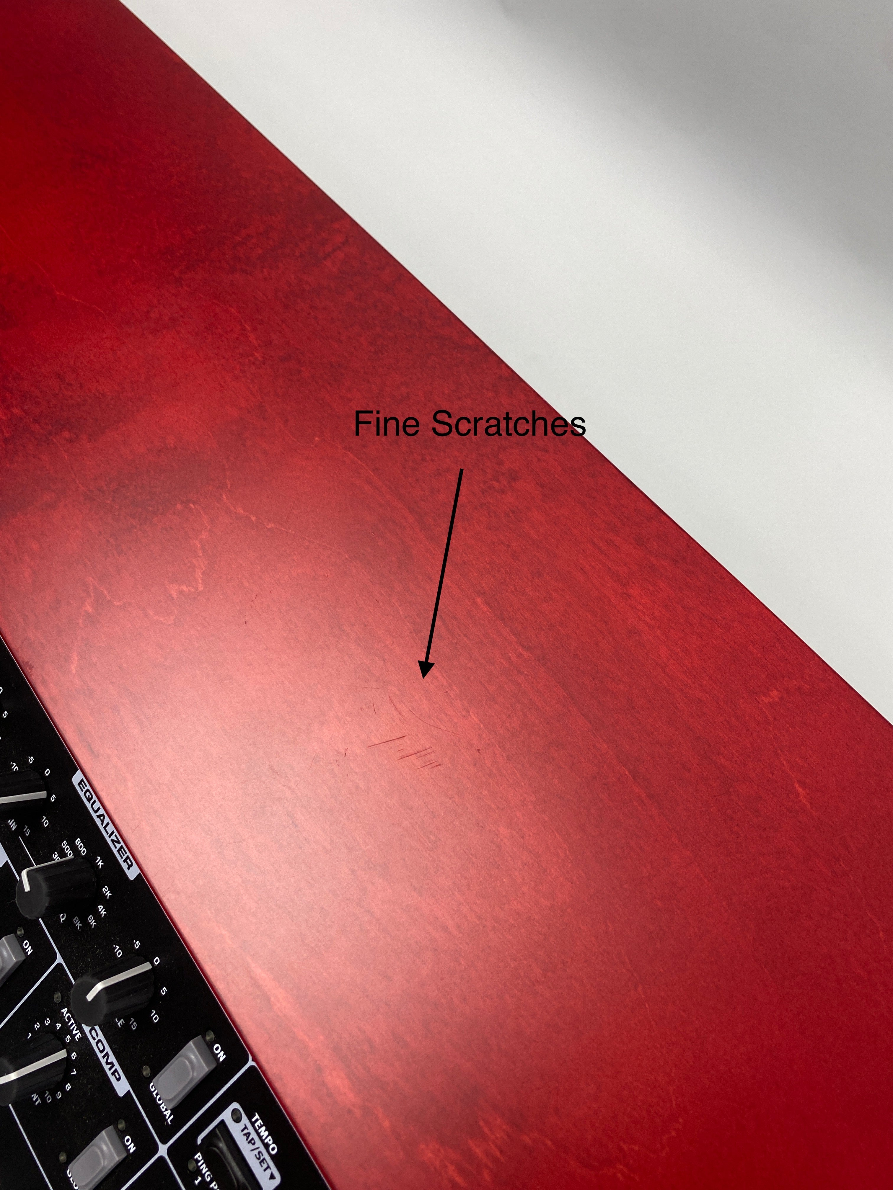 close up of some fine scratches on top of the cabinet