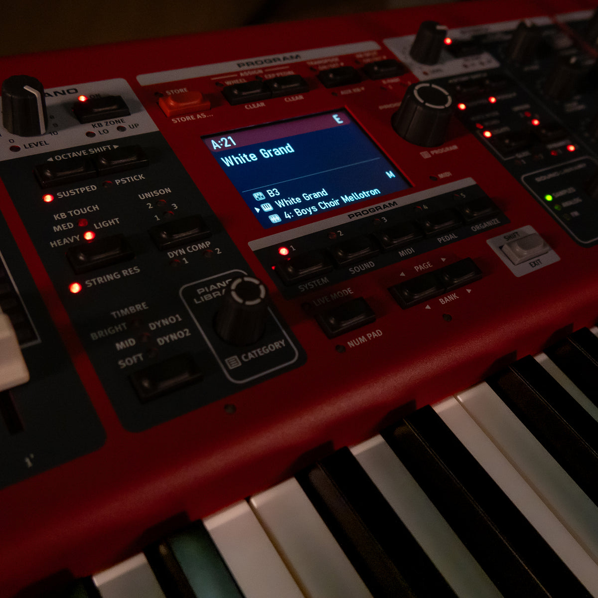 A close-up of a Nord Electro 7 with a small illuminated screen