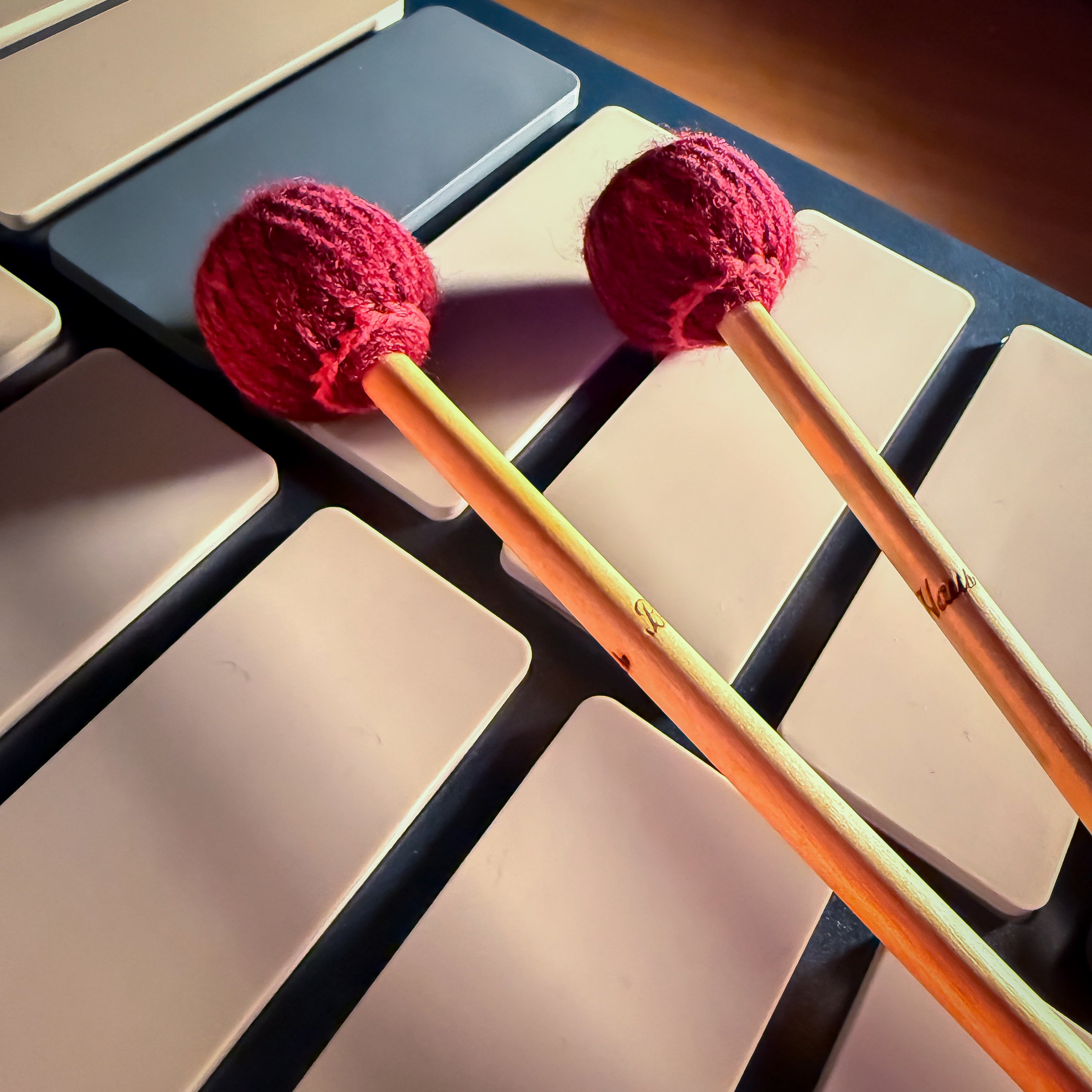 Two red mallets on a Pearl EMC malletStation EM Pro 2 Octave Controller