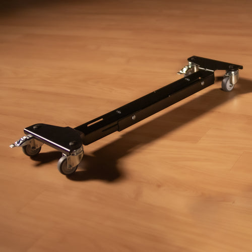 Close up of one of the K&M 18806 Trolley for Keyboard Stands on a floor in a studio