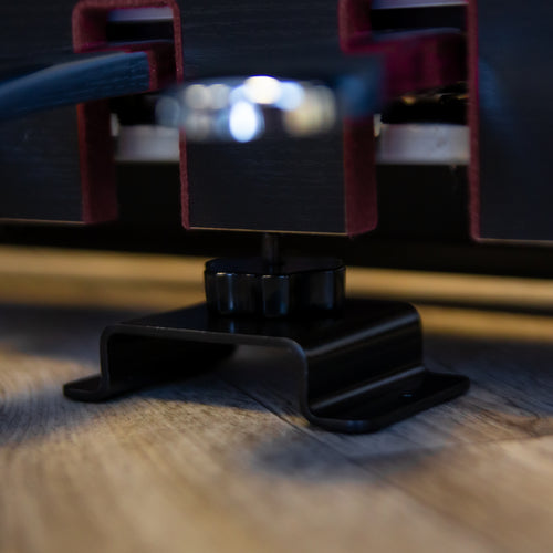 Stabilizing bracket under a digital piano that is on a K&M 18804 Trolley