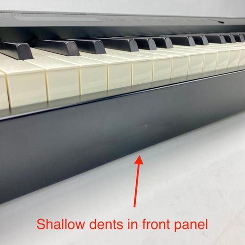 Shallow dents on the front panel of the instrument