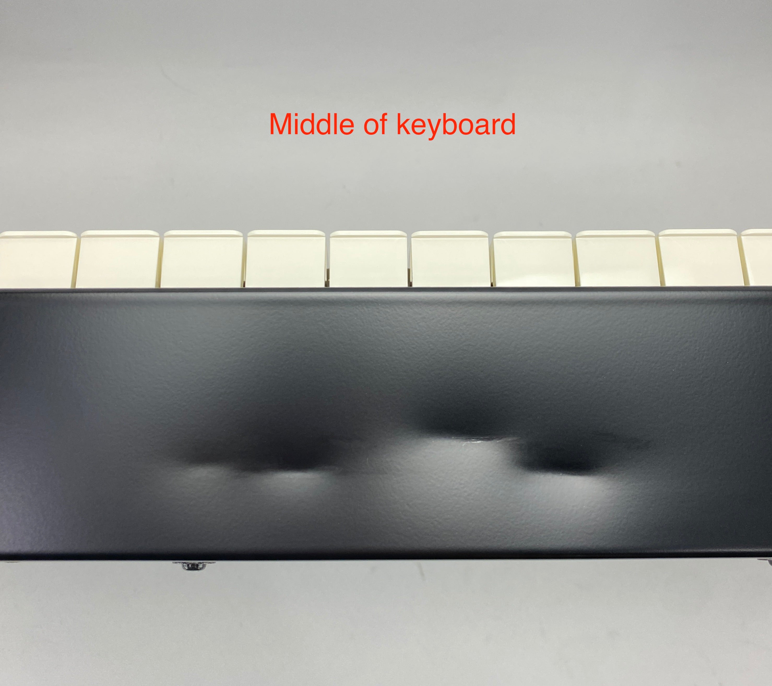 dents on the front panel of the instrument