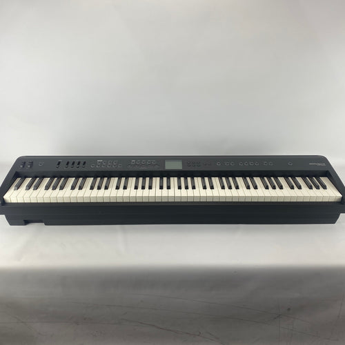 Roland FP-E50 88-key digital piano in black, full front view showing keyboard, control panel and display