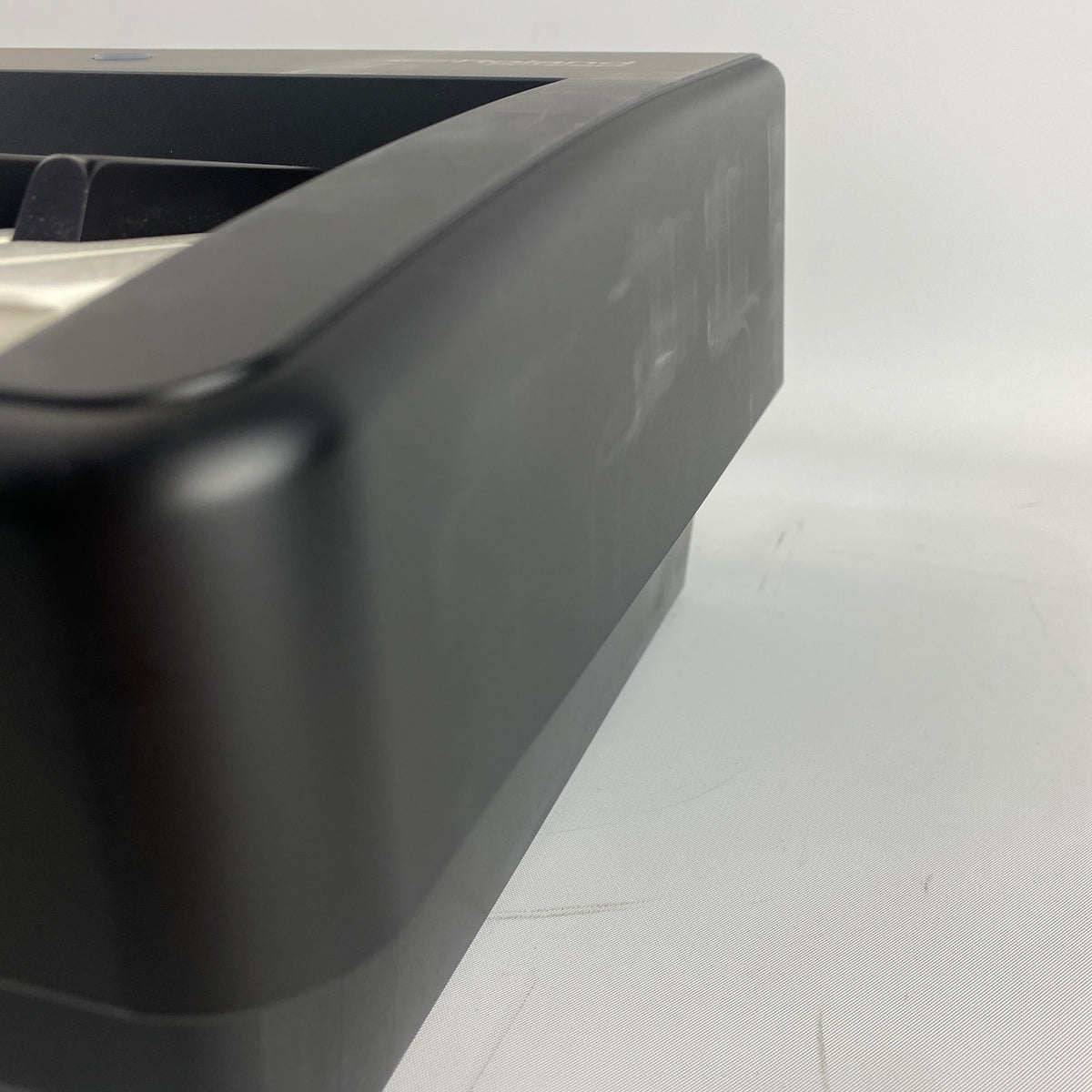 Right end cap of Roland FP-E50 digital piano showing whitish scuff marks on the side of the case
