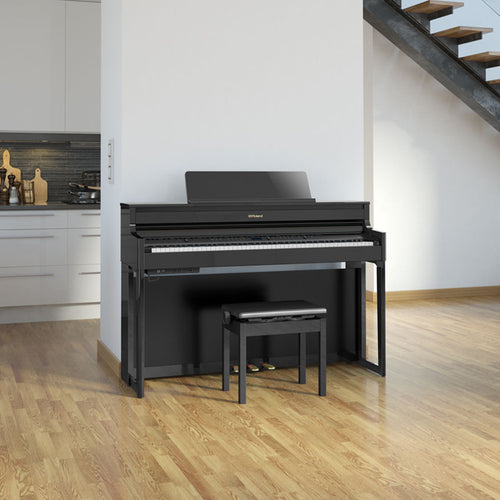 Roland HP704 Digital Piano - Polished Ebony - in a stylish living space