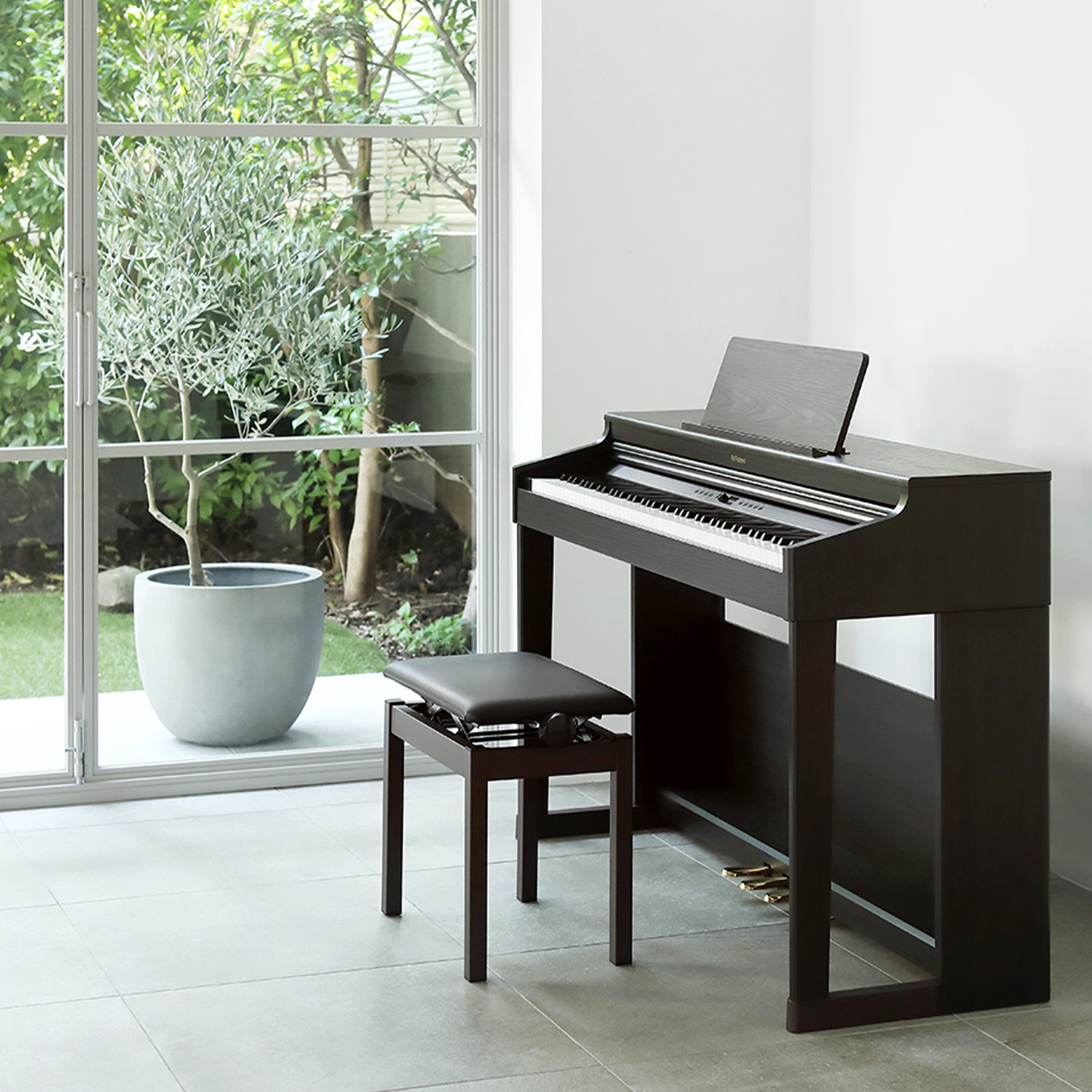 Roland RP701 Digital Piano - Dark Rosewood - in a stylish living room