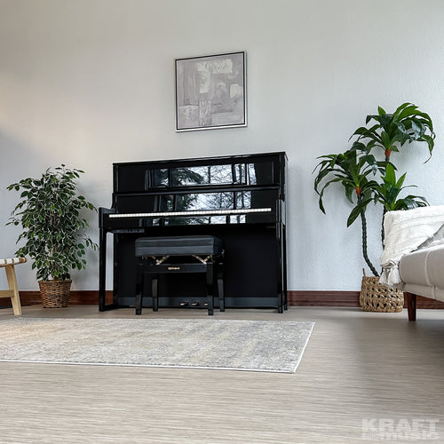 Roland LX708 Digital Piano - Polished Ebony - facing left in a stylish living room