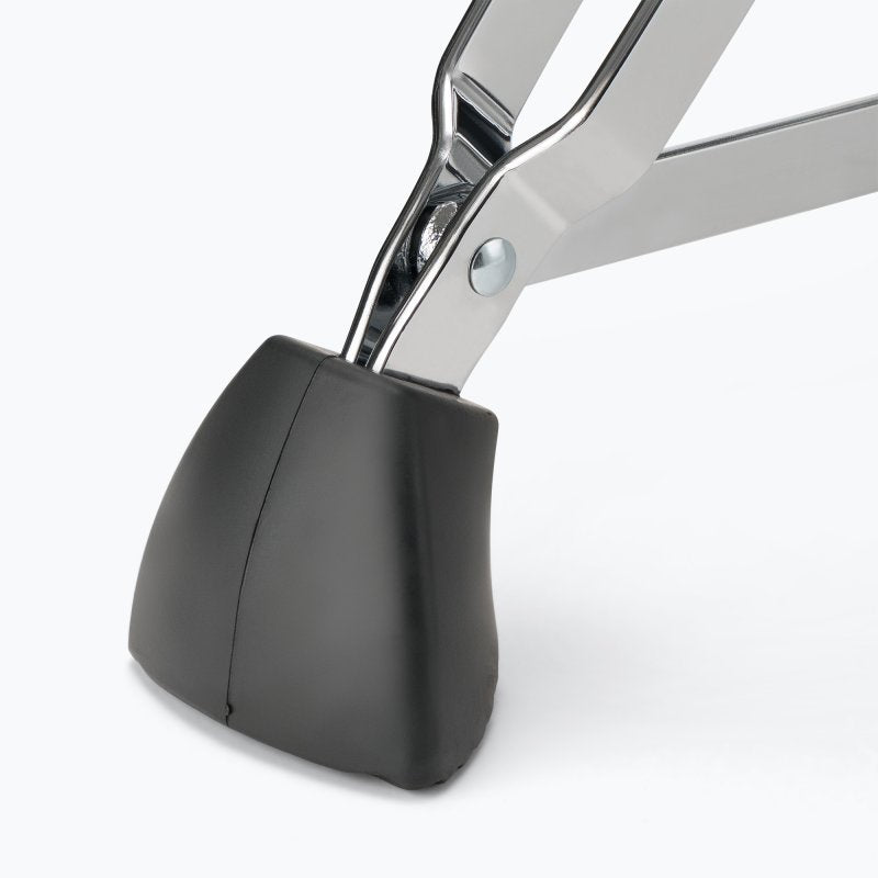 Detail of the throne's rubber foot cap on a double-braced chrome leg